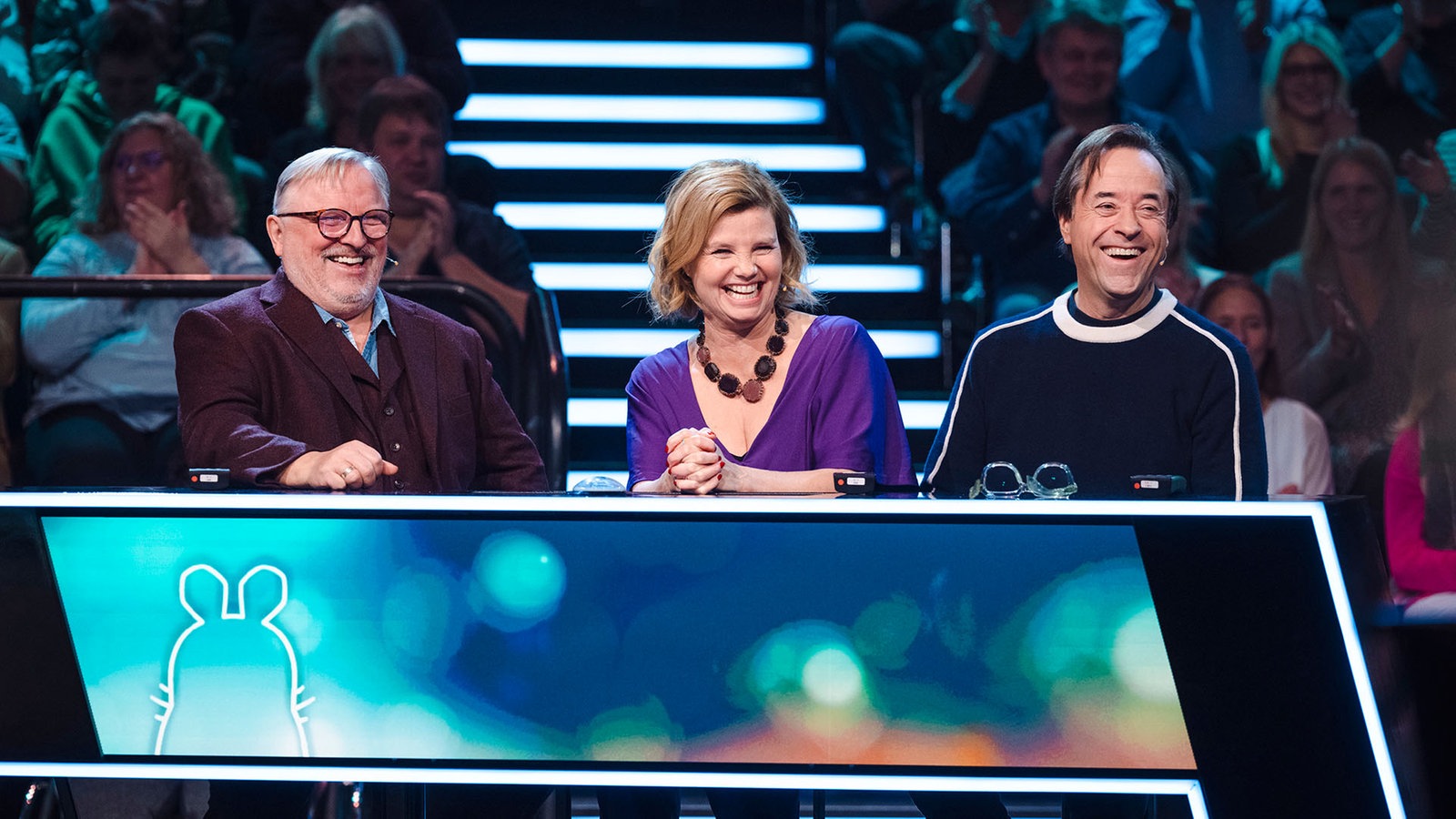 Anette Frier, jan-Josef Liefers und Axel Prahl lachen zusammen.