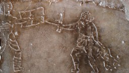 Römisches Graffiti zeigt eine Kampfszene.